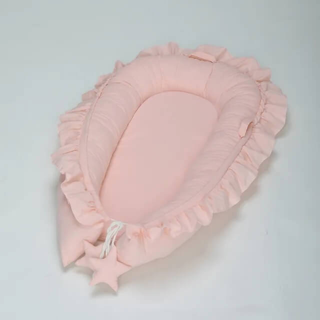 Réducteur de lit rose pour bébé fille